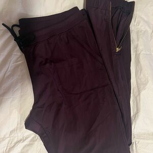 ZYIA Plum Peak Zipper Jogger with High Waistband and Slim Fit